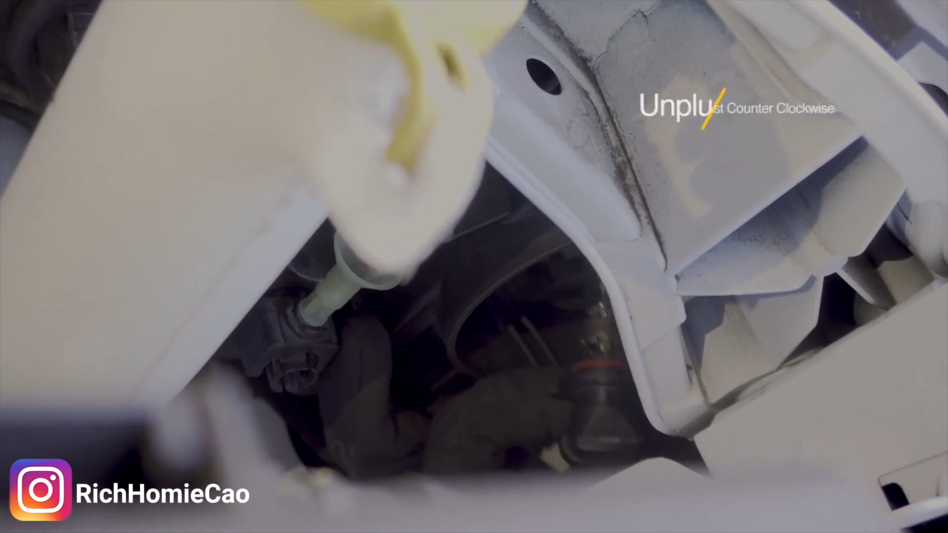 Rotate the factory halogen bulb counterclockwise to unlock it